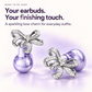 Silver rhinestone bow detail of clip-on earbuds